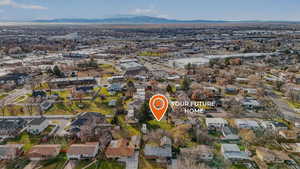 View of property location with nearby suburban area and a mountainous background