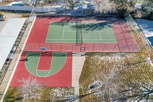 View of basketball court featuring a tennis court and community basketball court