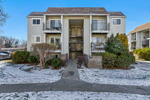 Snow covered property featuring a view of the complex