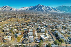 Aerial view of property and surrounding area with mountains