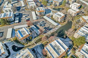 Aerial overview of property's location with a large body of water