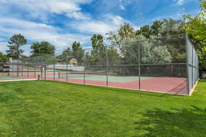 View of tennis court with community basketball court