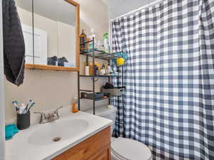 #31 (Upstairs 1-bedroom): Bathroom with a shower with curtain and vanity