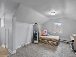#37 (Upstairs 2-bedroom): Bedroom #2 featuring carpet, lofted ceiling, and a baseboard radiator