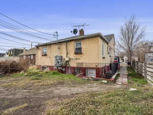 Rear of the property with basement entrance to shared laundry room and studio apartment unit #29