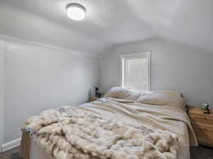 #37 (Upstairs 2-bedroom): Carpeted bedroom #1 with vaulted ceiling