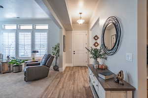 Foyer entrance featuring wood finished floors and baseboards