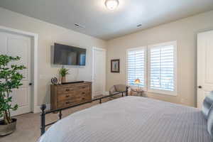 Bedroom with carpet and baseboards