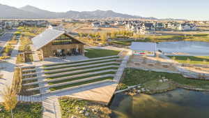 Aerial perspective of suburban area featuring a water and mountain view