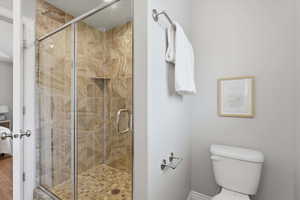 Ensuite bathroom with a stall shower and toilet