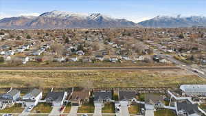 View of property location with nearby suburban area and a mountainous background