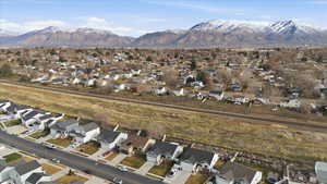 View of property location featuring nearby suburban area and mountains
