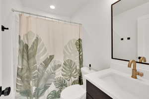 Full bath with vanity, and recessed lighting