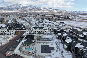 Aerial view with a mountain view and community amenities