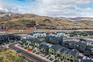 Aerial view W  with of mountains and Trappers Loop with access to Snow Basin and Pineview Reservoir