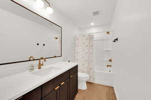 Full bathroom with shower / bath combination with vanity