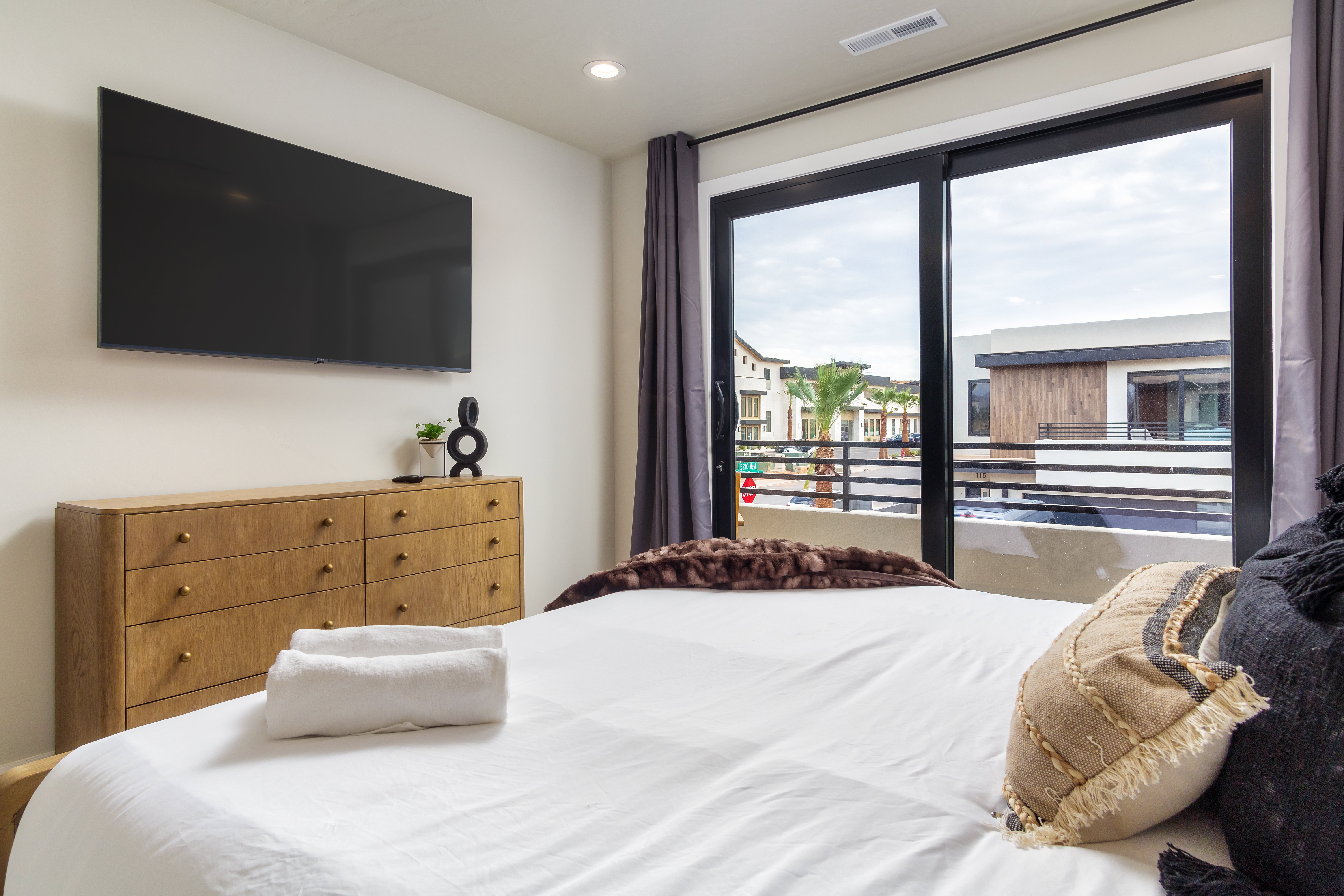 Bedroom featuring access to outside and recessed lighting