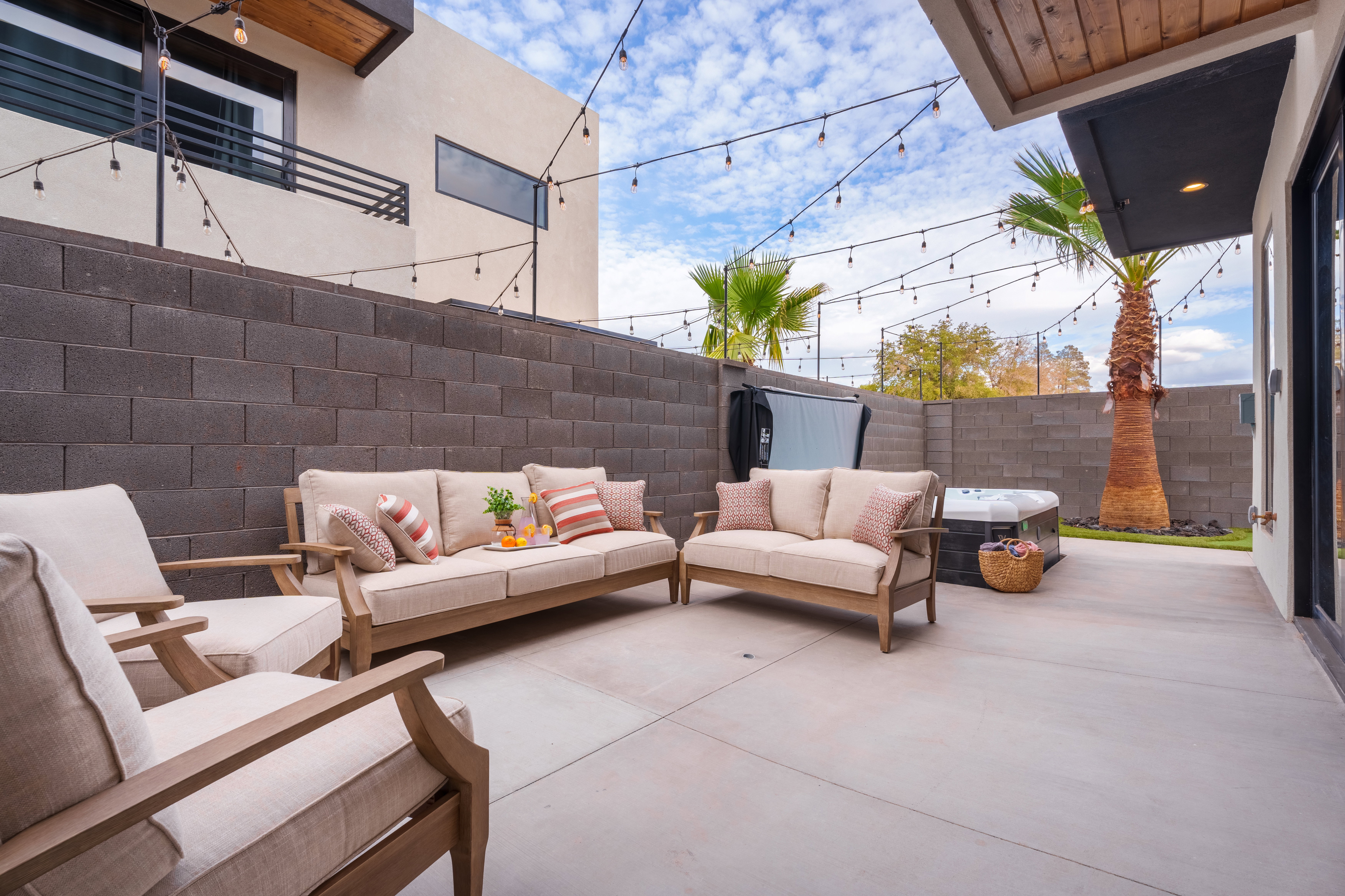 Fenced backyard with a patio area and outdoor lounge area
