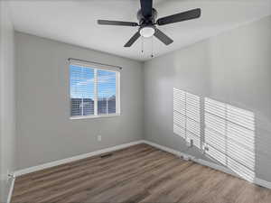 Bedroom #2 featuring dark wood finished floors and ceiling fan
