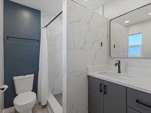 Primary bathroom with vanity, and recessed lighting