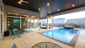 View of swimming pool featuring a fenced backyard and a patio area