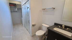 Casita Full Bathroom with a stall shower, vanity, and light tile patterned floors