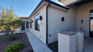 View of property exterior with stucco siding