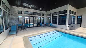 Swimming pool with a patio area