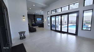 Common area with recessed lighting and a towering ceiling