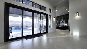 Entryway with baseboards and recessed lighting
