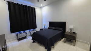 Bedroom 1  with recessed lighting, ceiling fan, and light tile patterned floors