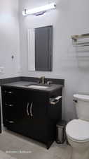 Bathroom 1 with light tile patterned floors and vanity