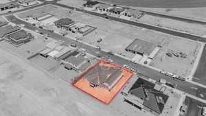 Aerial view of property and surrounding area with property parcel outlined