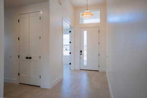 Foyer with healthy amount of natural light and light floors
