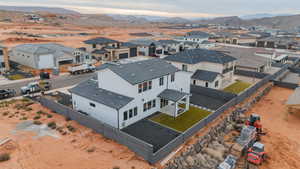 Aerial perspective of suburban area with a mountain backdrop