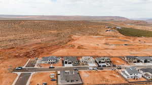 Aerial overview of property's location featuring nearby suburban area and rural landscape