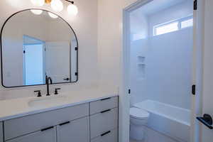 Full bathroom with vanity and bathtub / shower combination