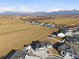 Overview of rural landscape featuring nearby suburban area and a mountain backdrop