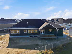 Back of house with deck