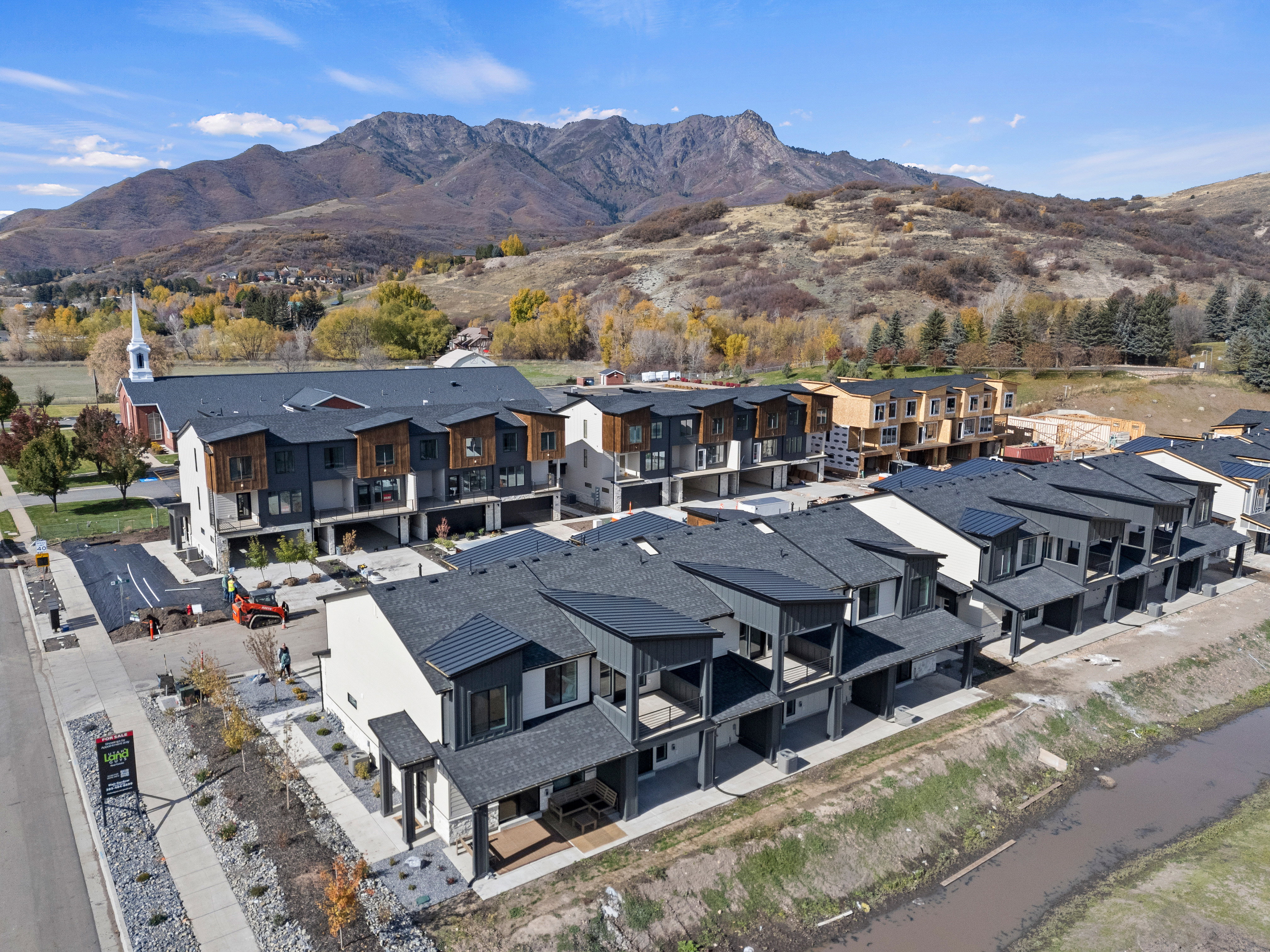 Aerial perspective of suburban area with a mountainous background