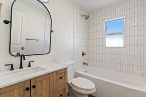 Bathroom featuring shower / bath combination and vanity