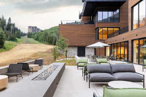Patio / terrace featuring outdoor dining area, an outdoor living space with a fire pit, and a patio