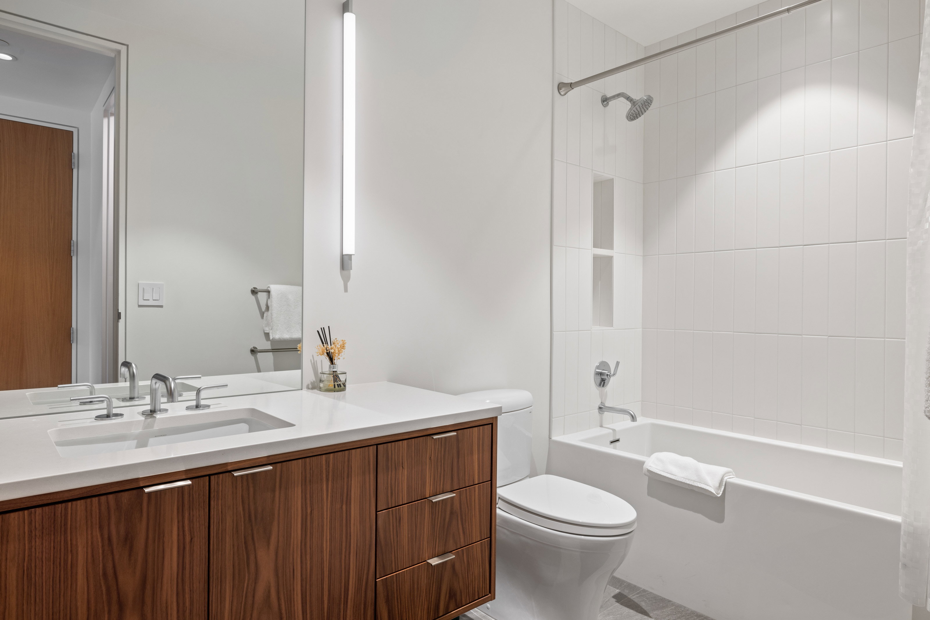 Bathroom featuring vanity and shower / tub combo with curtain