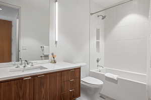 Bathroom featuring vanity and shower / tub combo with curtain