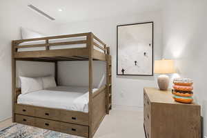 Bedroom with light carpet