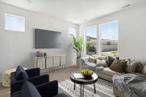 Living area featuring wood finished floors and baseboards
