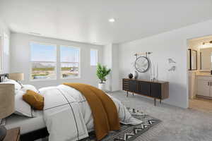 Bedroom featuring carpet flooring and connected bathroom