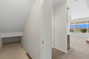 Hall featuring light colored carpet