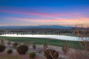View of mountain backdrop featuring a large body of water