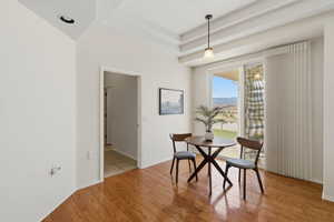Dining room featuring light wood-style flooring and baseboards